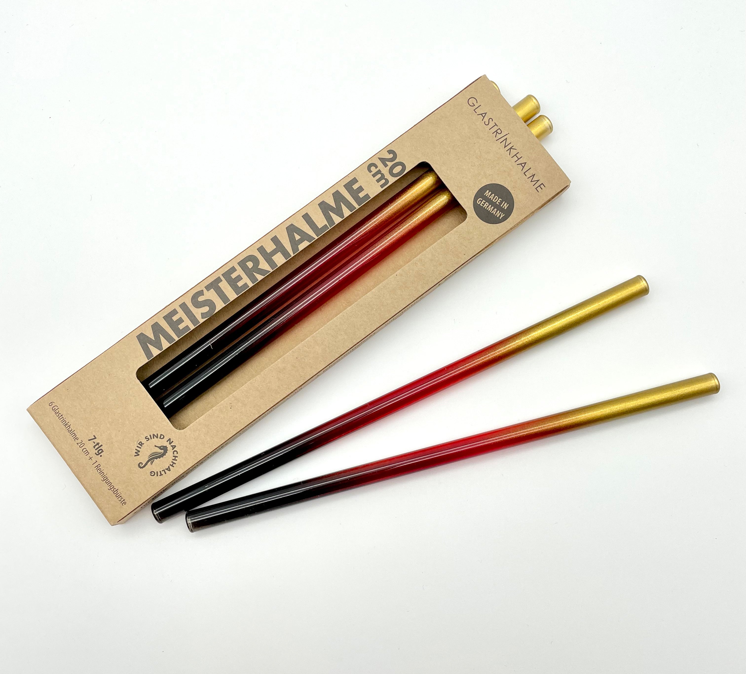 Im Set. enthalten sind 6 Glastrinkhalme in Schwarz-Rot-Gold (20 cm, gerade), und eine Reinigungsbürste aus Nylon. Offene Verpackung