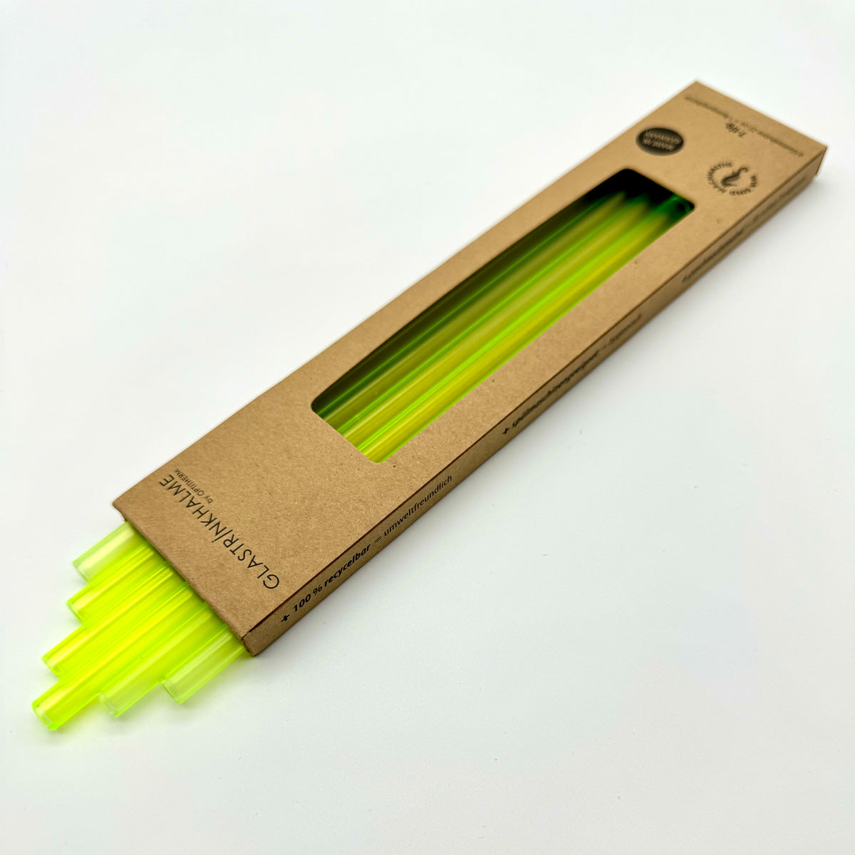 Im Set enthalten sind 6 neongelbe Glastrinkhalme (23 cm, gerade), und eine Reinigungsbürste aus Nylon. Offene Verpackung.
